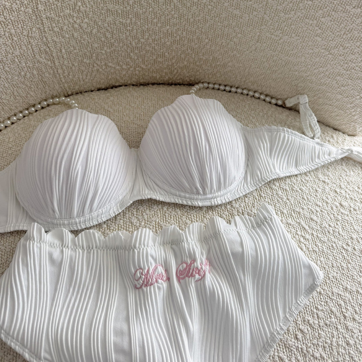 White bikini with a textured background