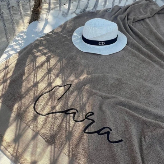 personalised towel on sun lounger with the name Cara