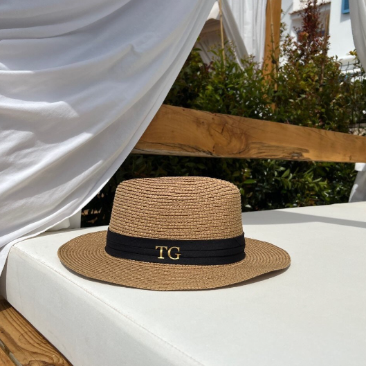 Personalised Beach Hat on white sunlounger with wooden frame