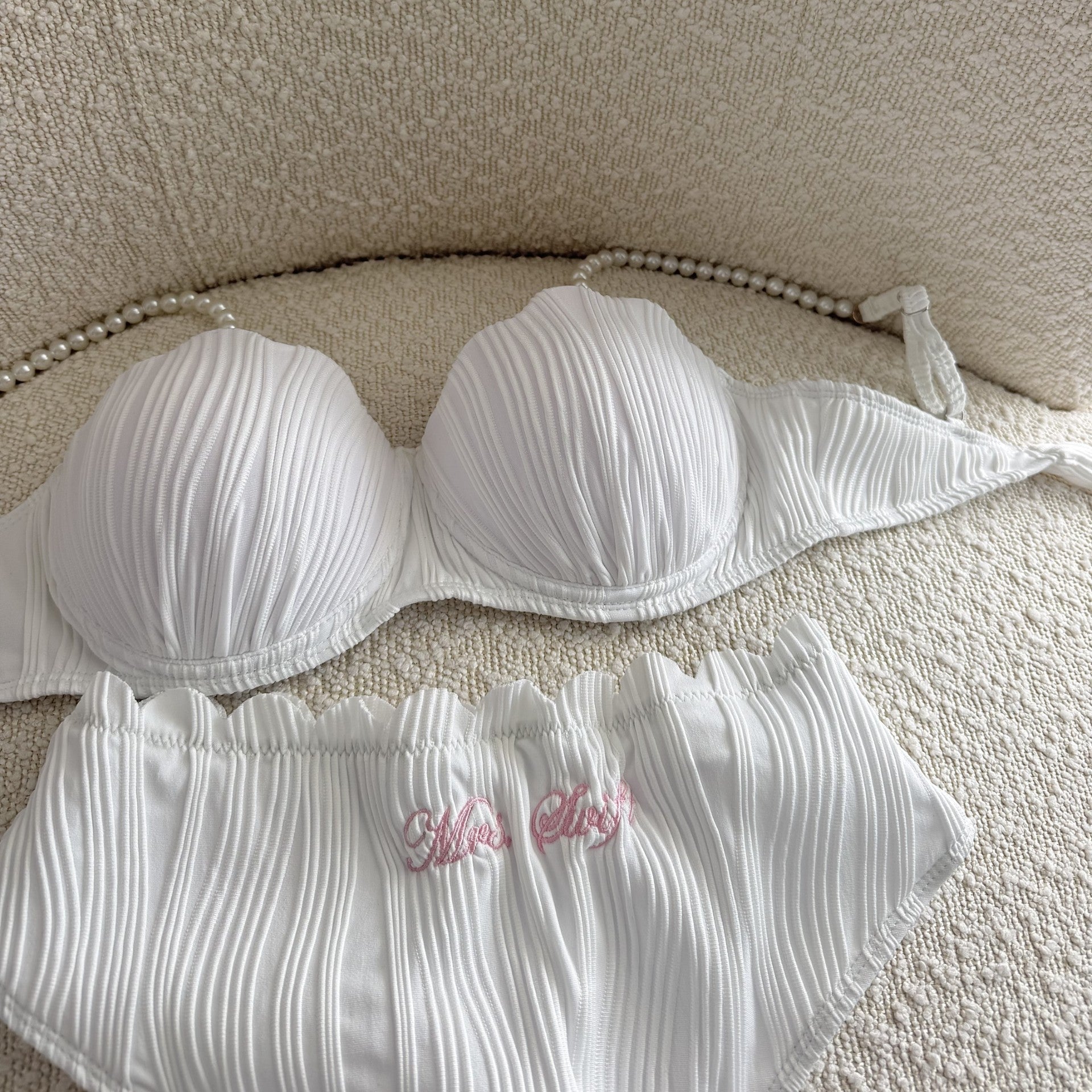 White bikini with a textured background