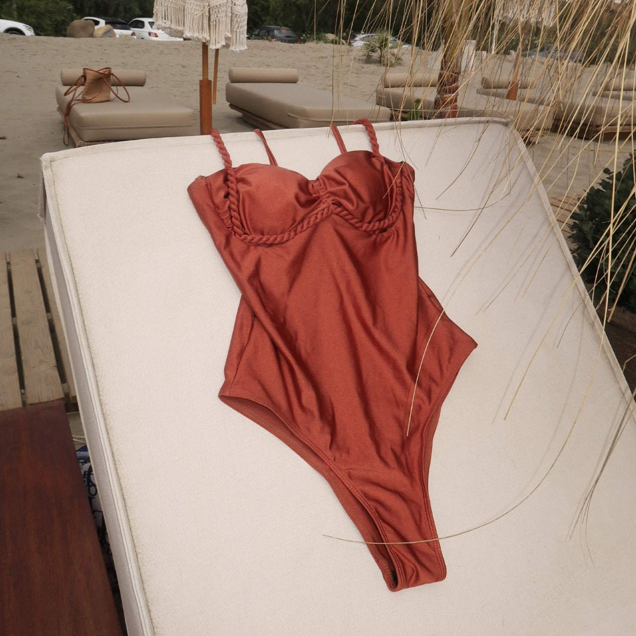 brown swimwear on a beach bed