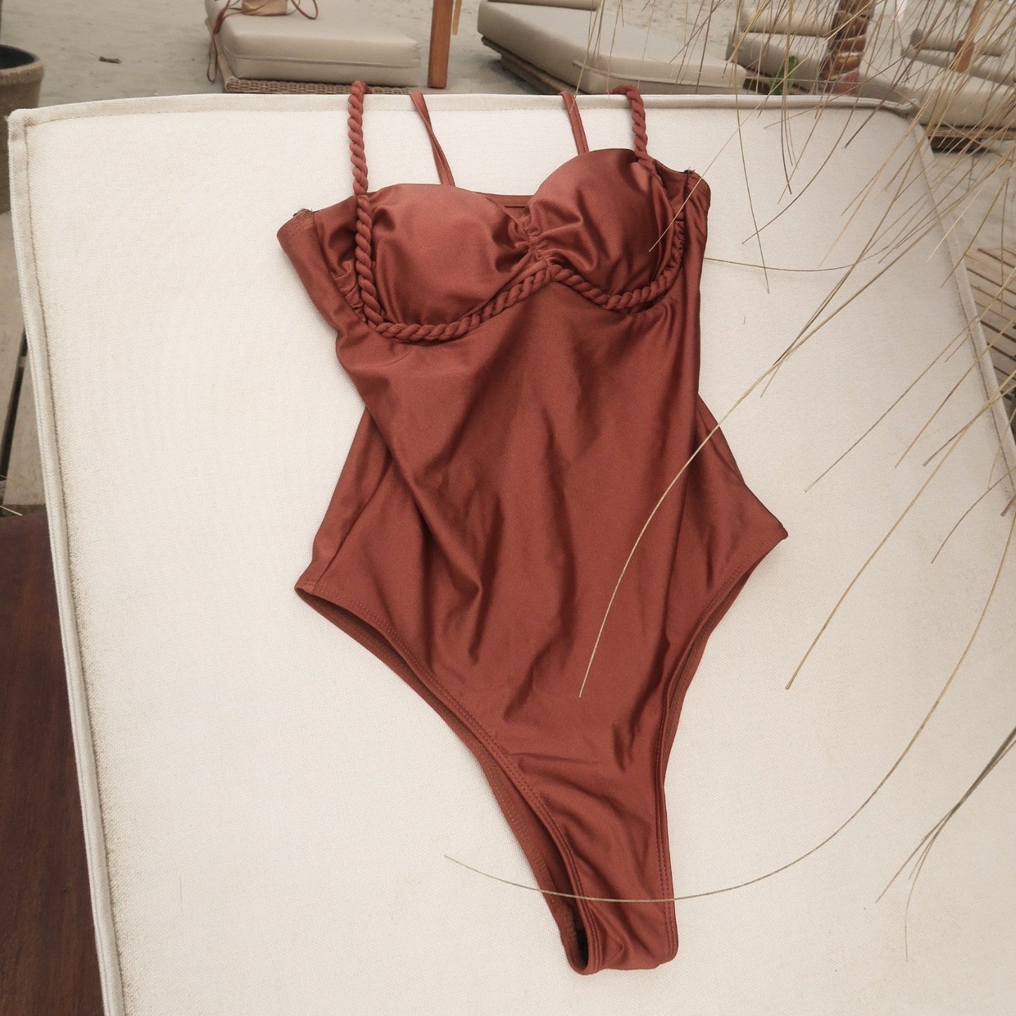 front of a brown swimsuit on a sun lounger