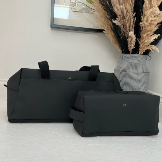 Black shoe bag personalised with matching black duffel bag