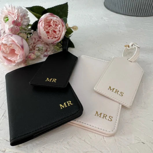 Black and white Mr and Mrs passport holders