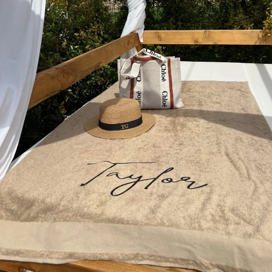 personalised towel on sunlounger with the name Taylor on it 
