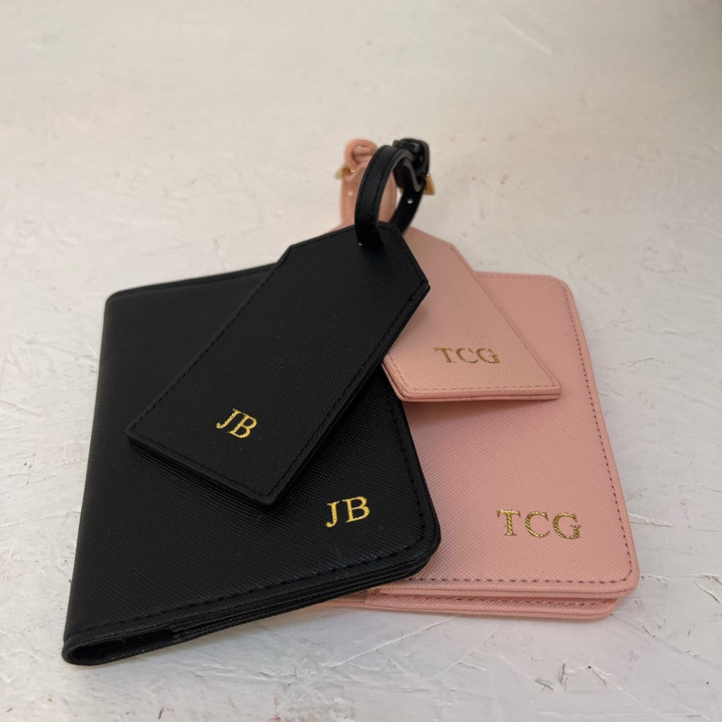Black and pink card passport sets with initials on a light background