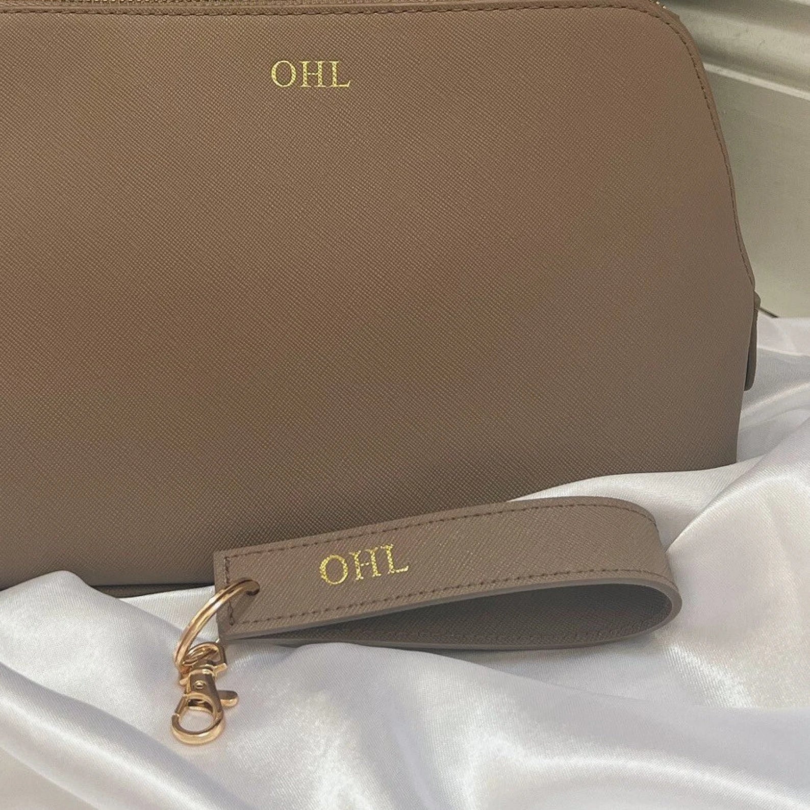 Personalised Key Ring. Image shows one colour of the key ring but shows it with a matching wash bag