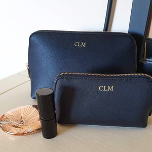 Two  black make up  bags with 'CLM' initials 