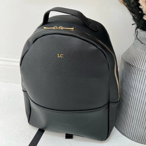 Black backpack with gold initials LC