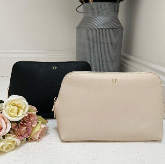 Personalised Make Up Bag in beige and black. Beige bag in front of black bag.
