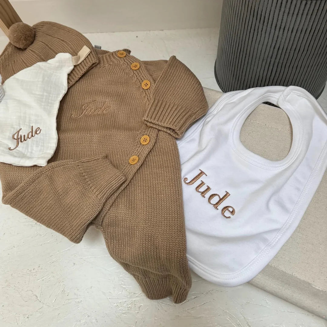 Brown baby outfit with white bib and matching set with the name jude