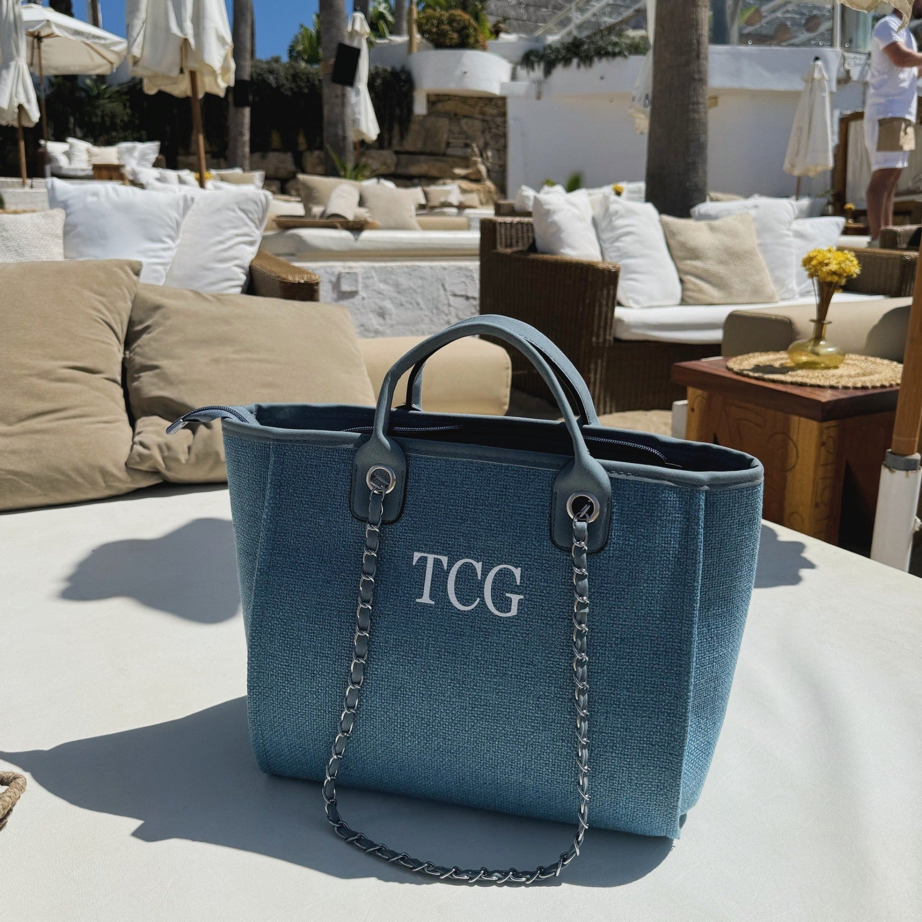 personalised blue tote bag at a beach club on sunlounger
