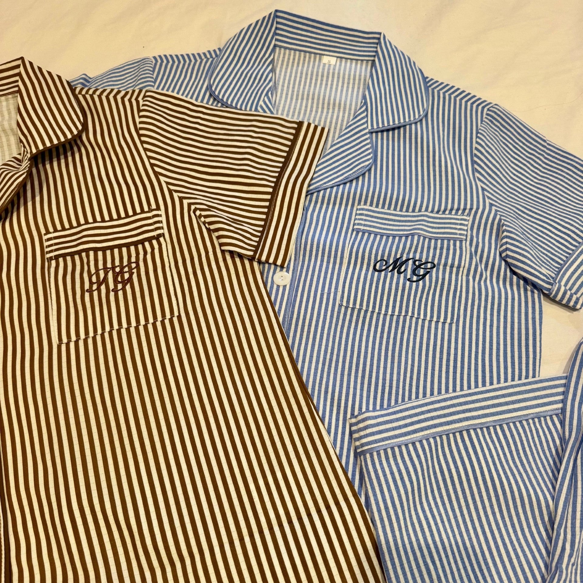 image of close up of personalised pjs on a flat service with initials on them