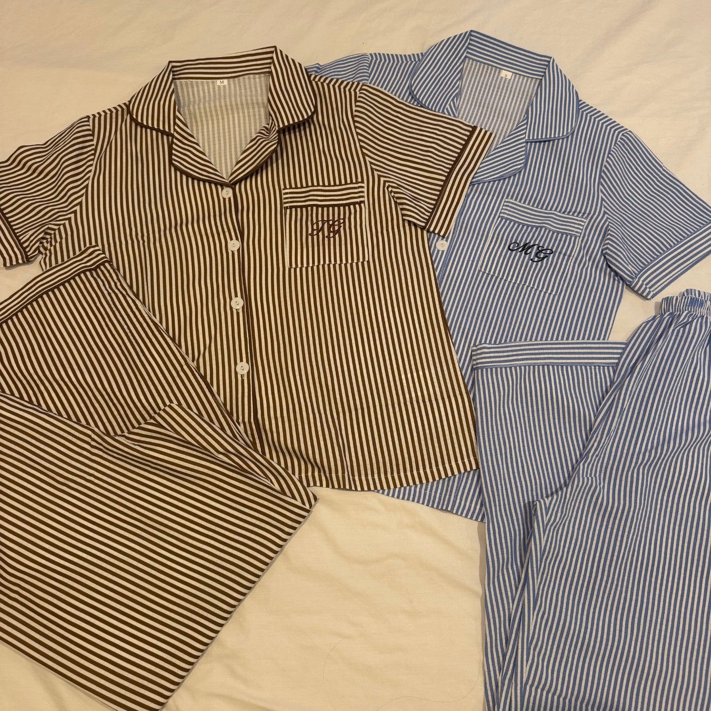 zoomed out image of personalised stripe pjs on a flat service