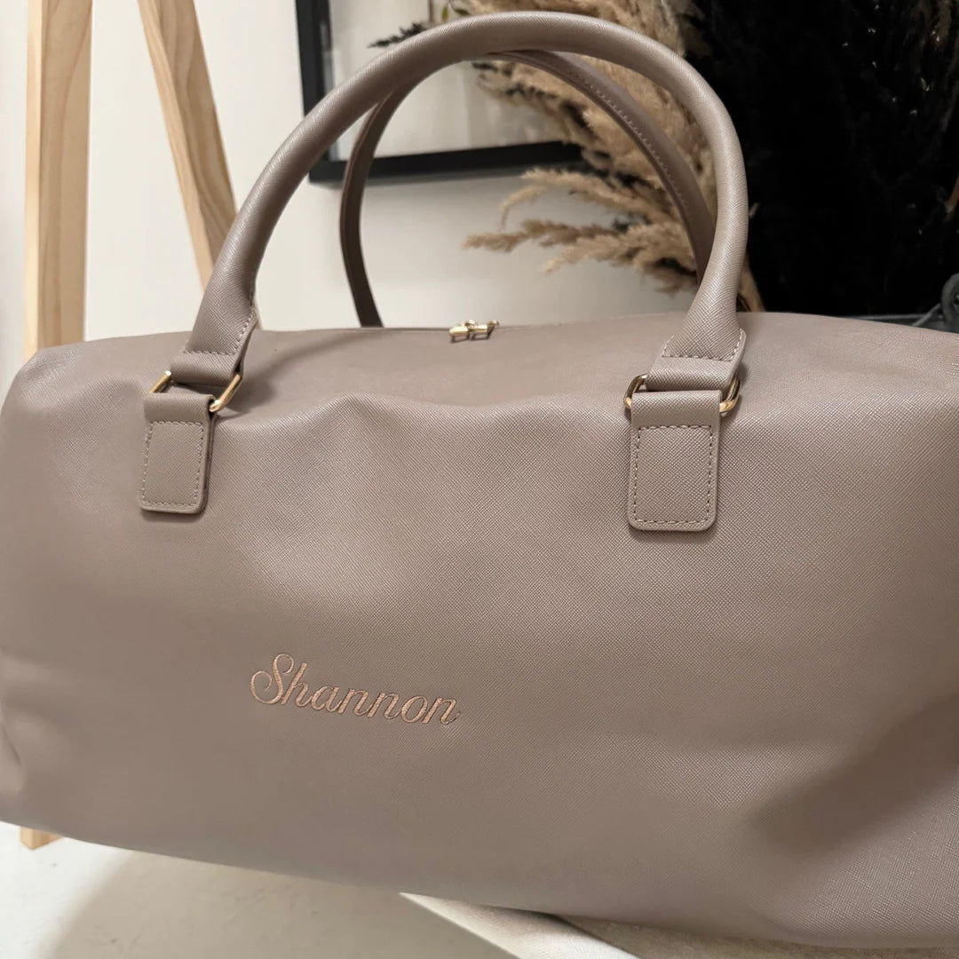 Beige handbag with 'Shannon' branding on a neutral background