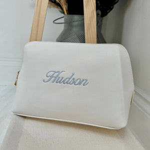 White washbag with 'Hudson' embroidery on a light background