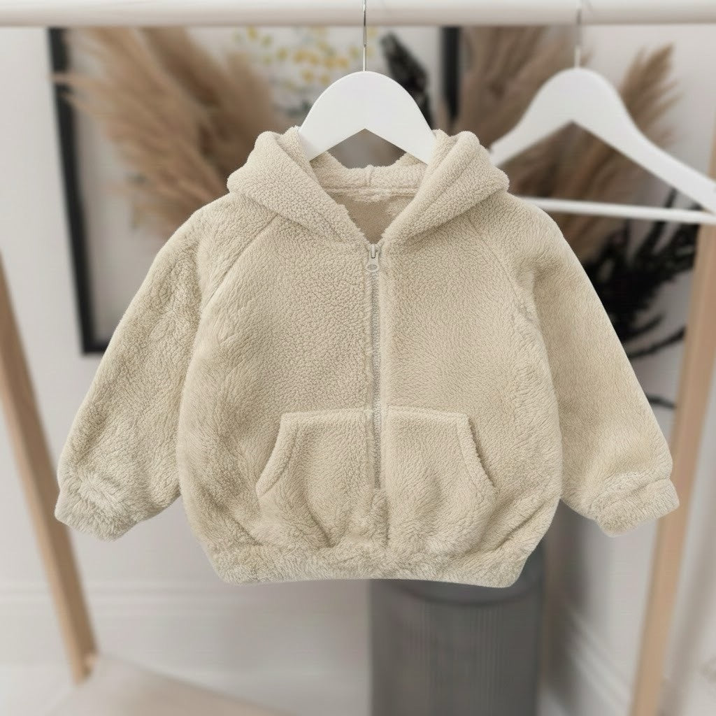 Beige fleece jacket on a hanger against a neutral background
