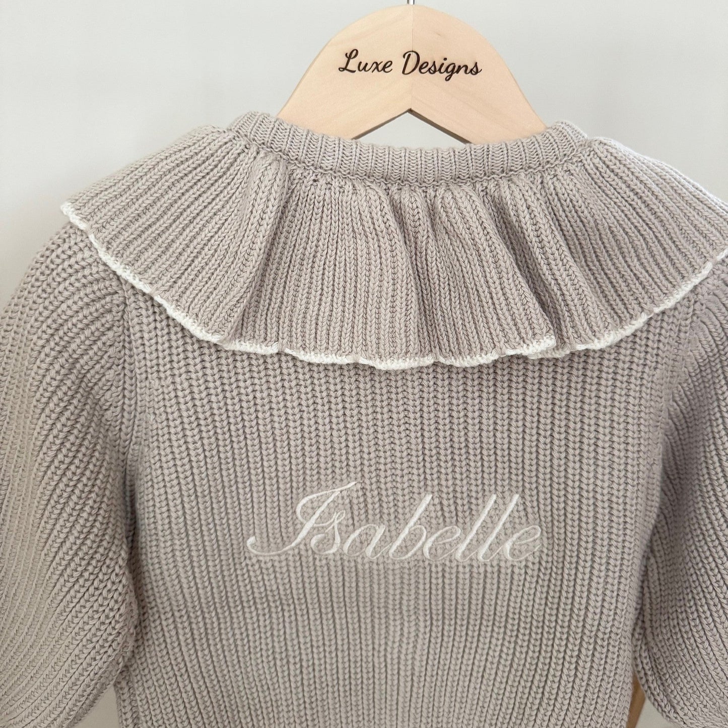 Close up of cardigan showing personalised name