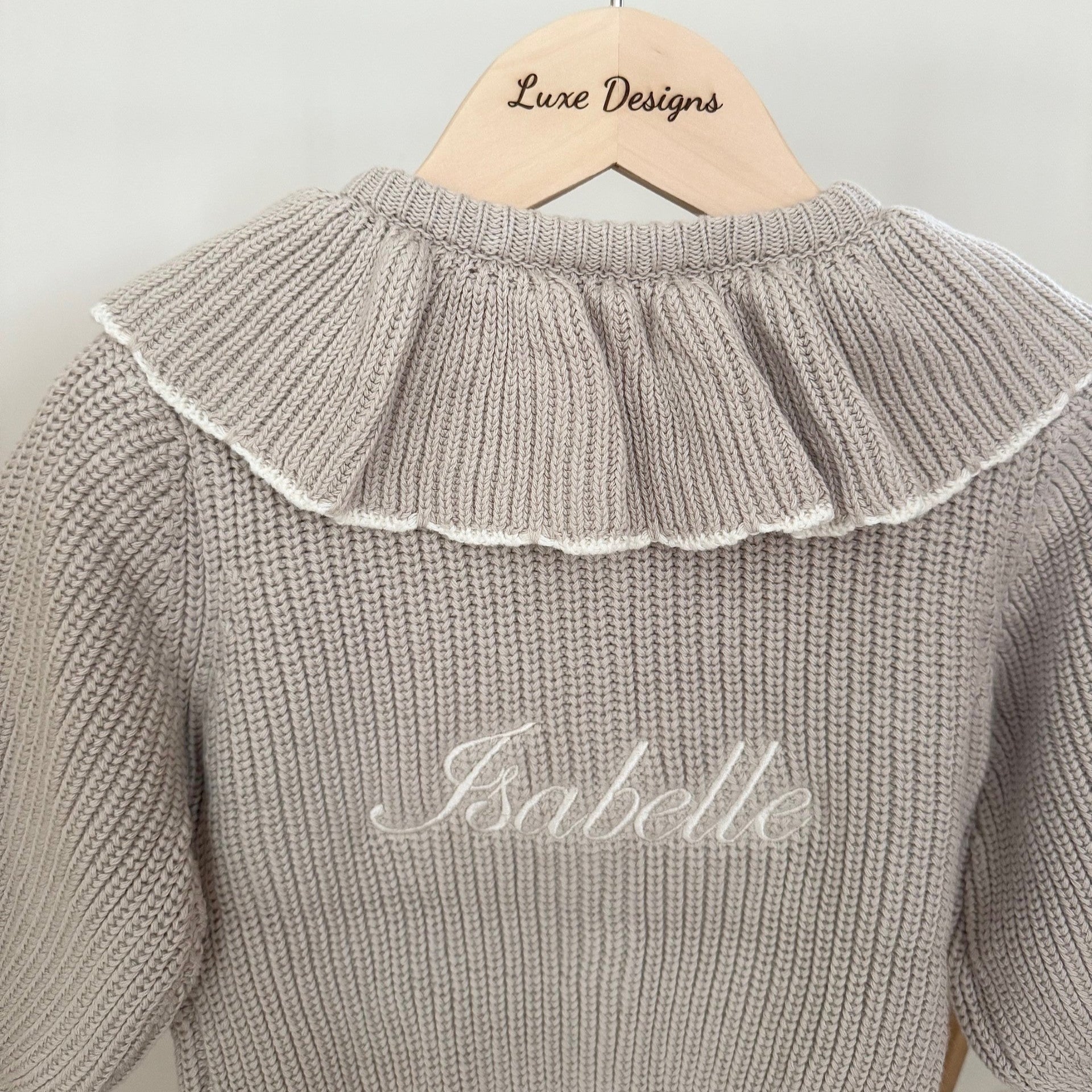 Close up of cardigan showing personalised name