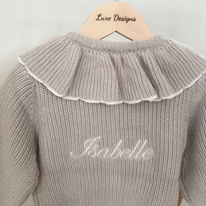 Close up of cardigan showing personalised name