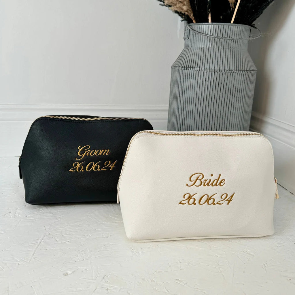 Black and white cosmetic bags with 'Groom' and 'Bride' text on a light background