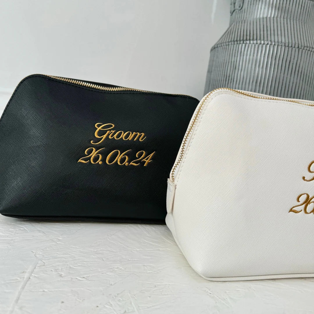 Black washbag with groom and wedding date embroidered onto it