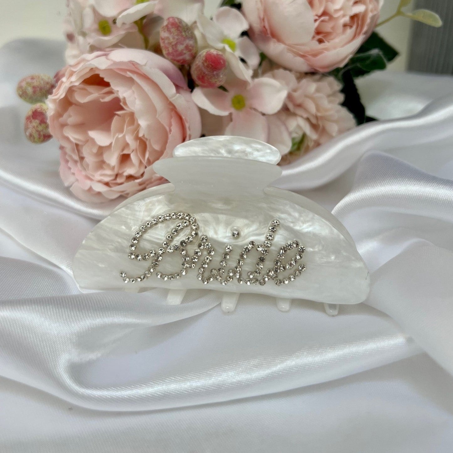 bridal hair clip on silk sheet