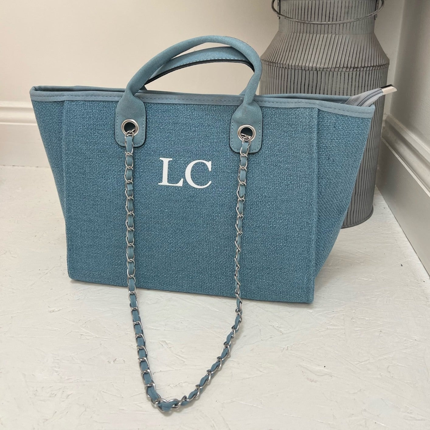 personalised blue tote bag on white floor