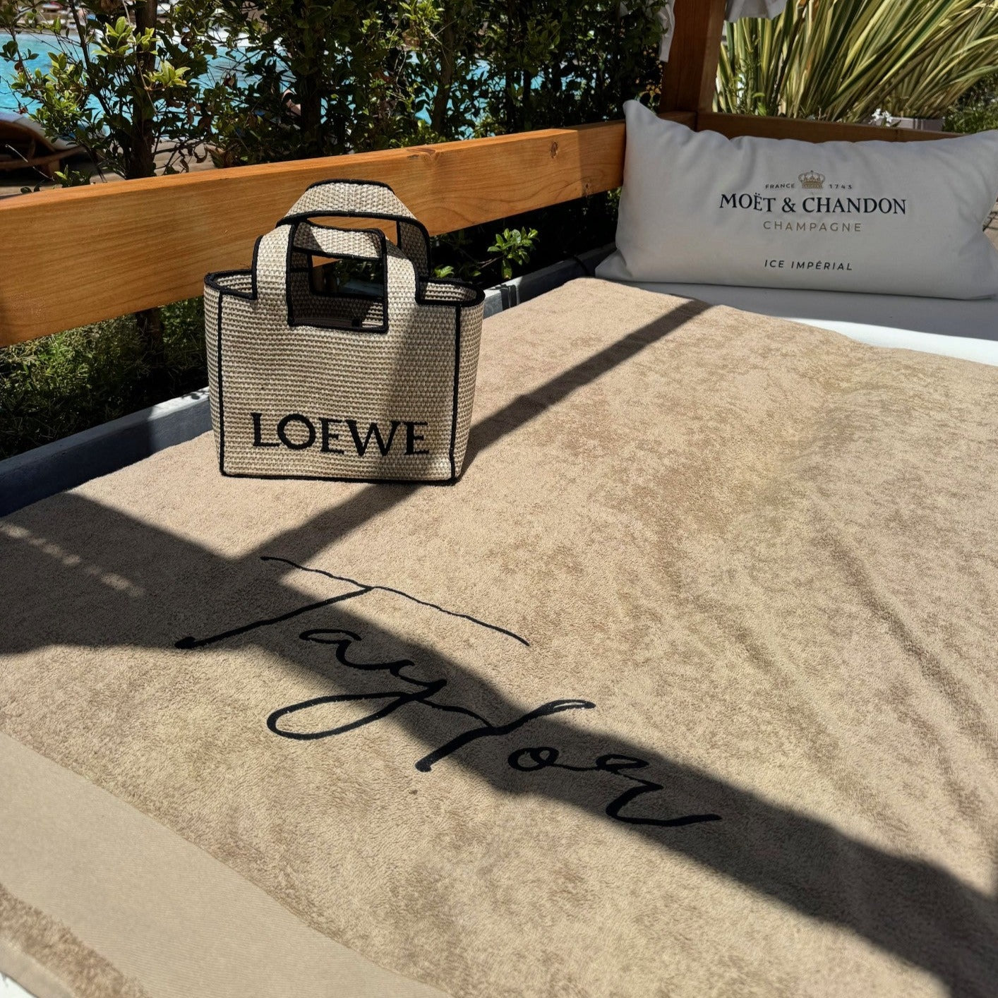 Personalised towel on a beach bed 