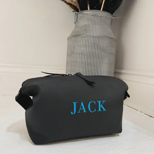 Black wash bag with turquoise jack personalised on it