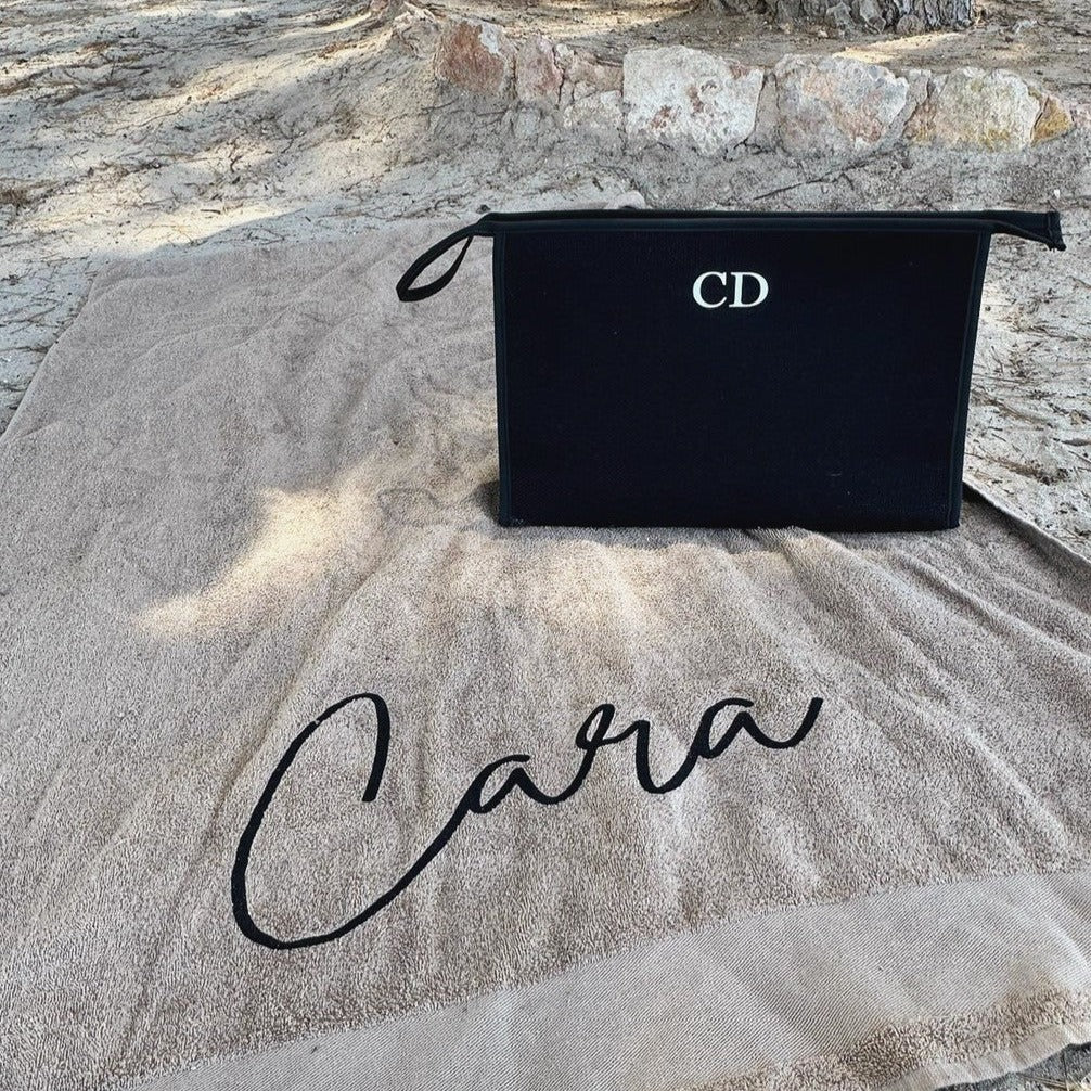 custom black clutch bag with initials CD on it with personalised beach towel