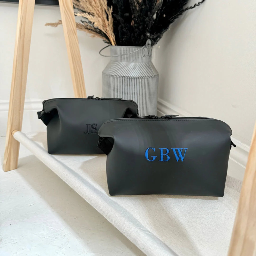 two black washbags personalised one with black and one with turquoise