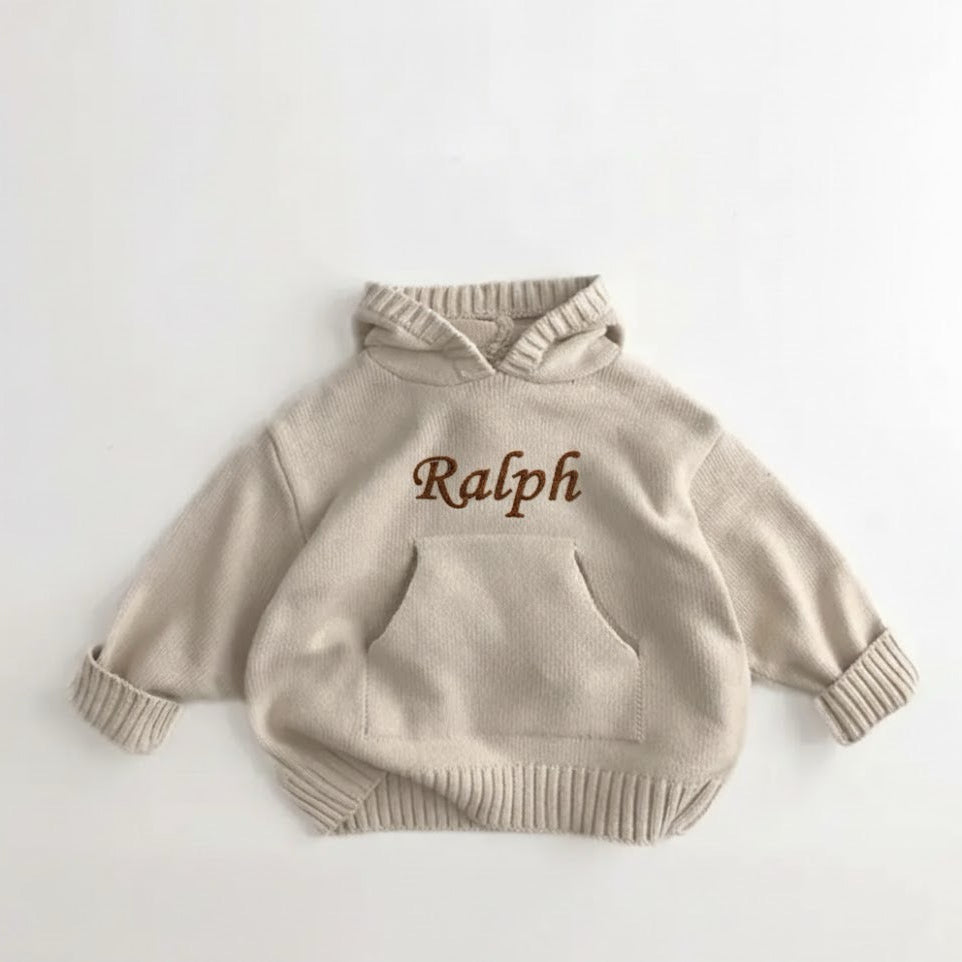 Beige hoodie with 'Ralph' embroidery on a light gray background