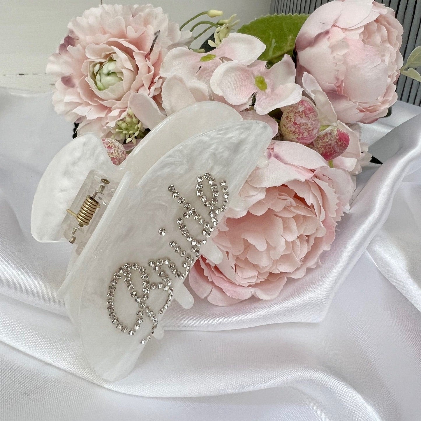 bridal hair clip on a bed of flowers