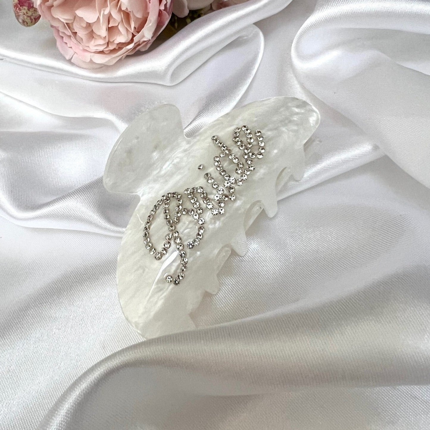 bridal hair clip on white silk sheet