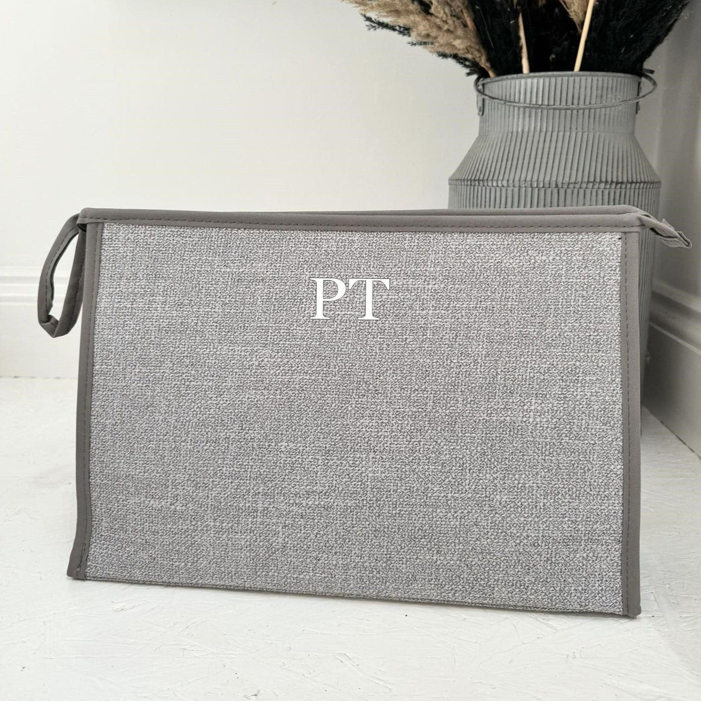 grey tote bag with initials PT on it