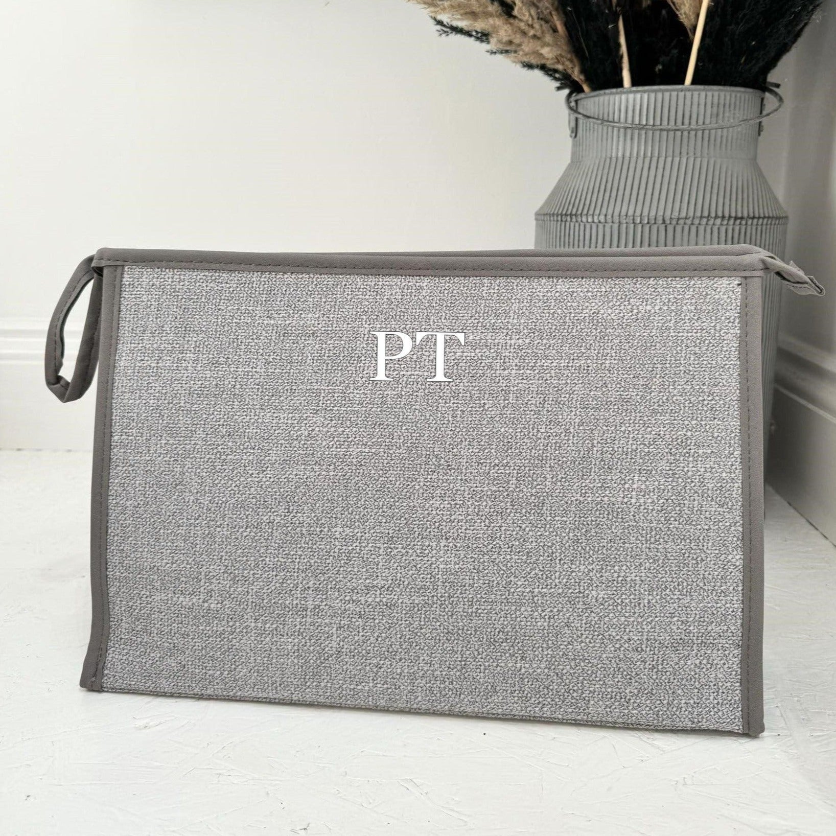 grey tote bag with initials PT on it