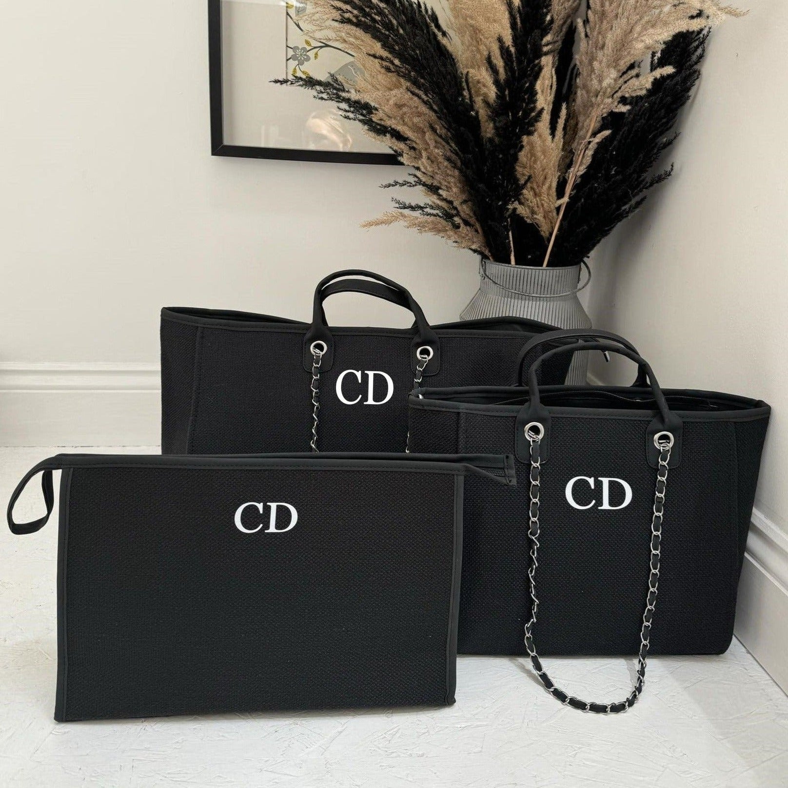 three tote bags with custom initials on in black