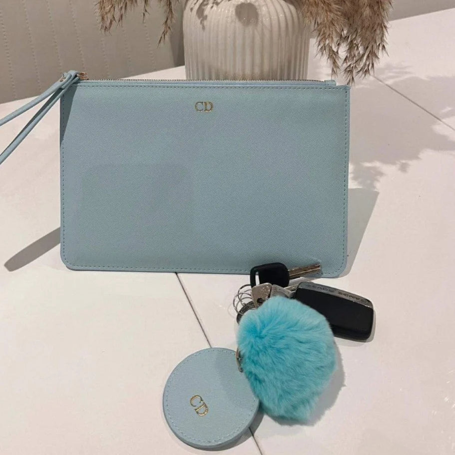 Light blue clutch bag with matching round Key Chain 