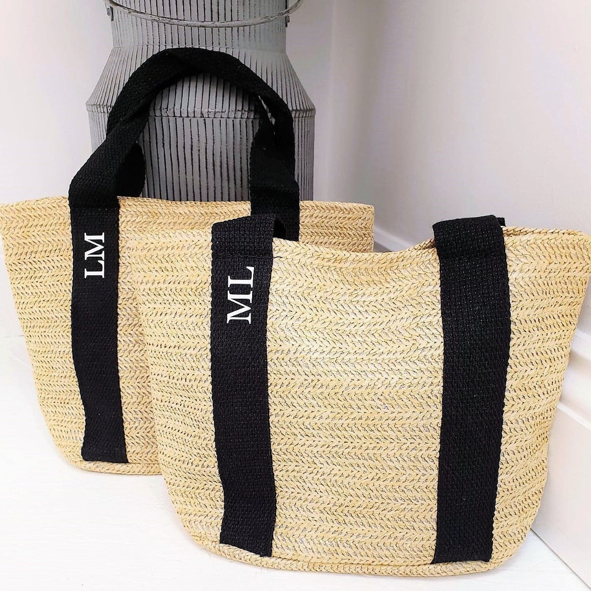 two personalised mini tote bags with ML and LM on them