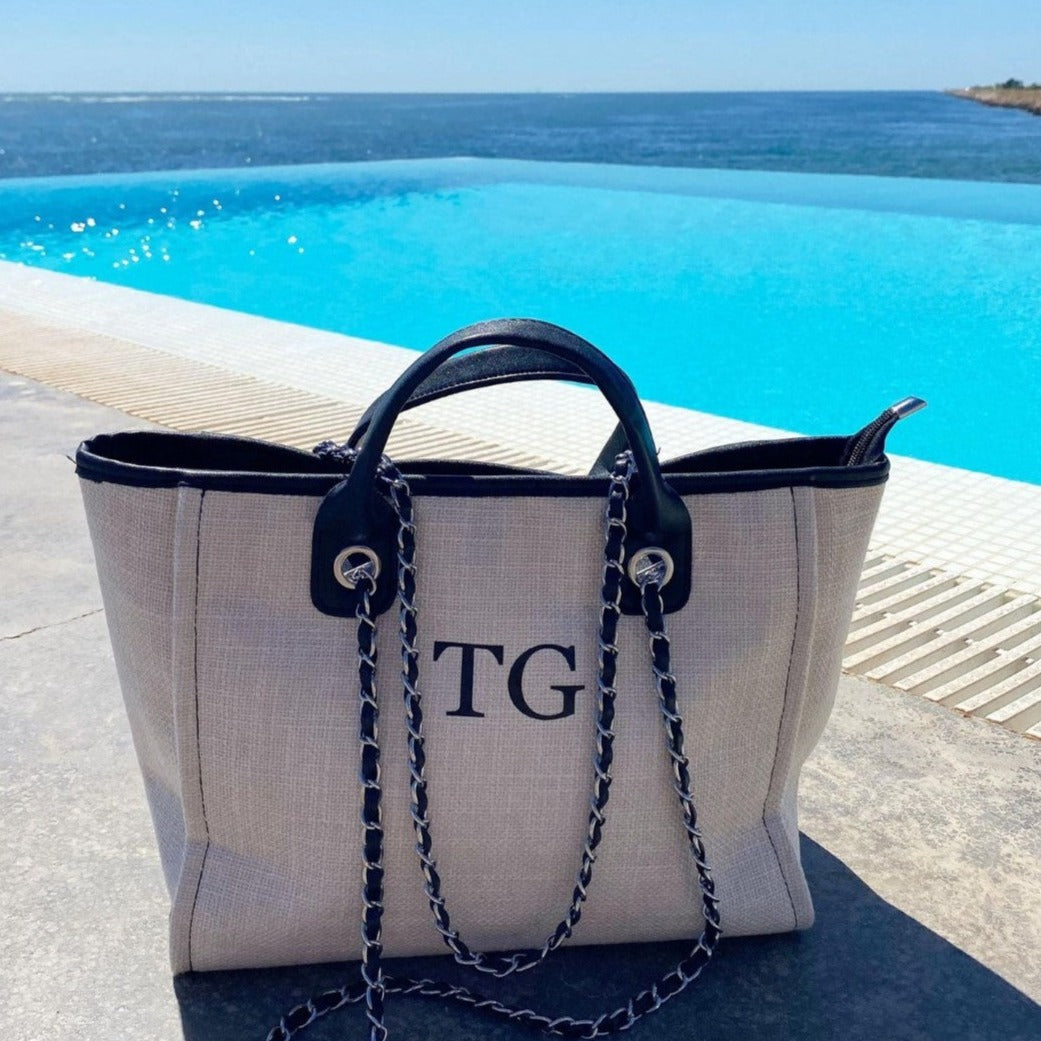 Personalised tote bag by a pool and the sea